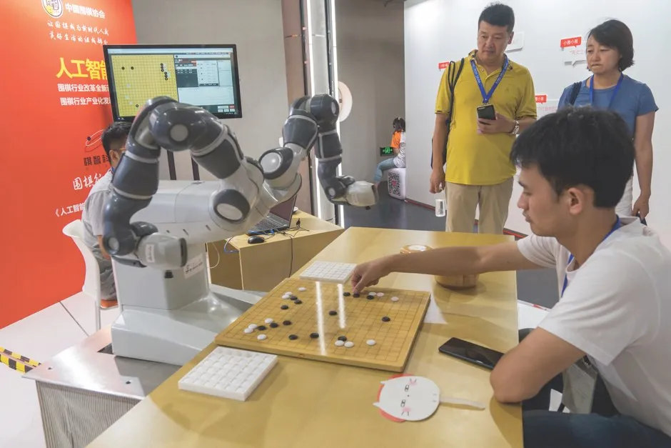 A robotic arm plays Go against a human opponent at an AI conference in Shanghai © Getty Images A robotic arm plays Go against a human opponent at an AI conference in Shanghai © Getty Images