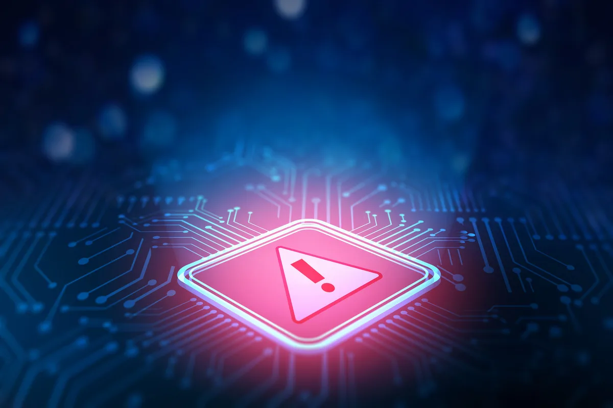 A glowing warning sign in a circuit board