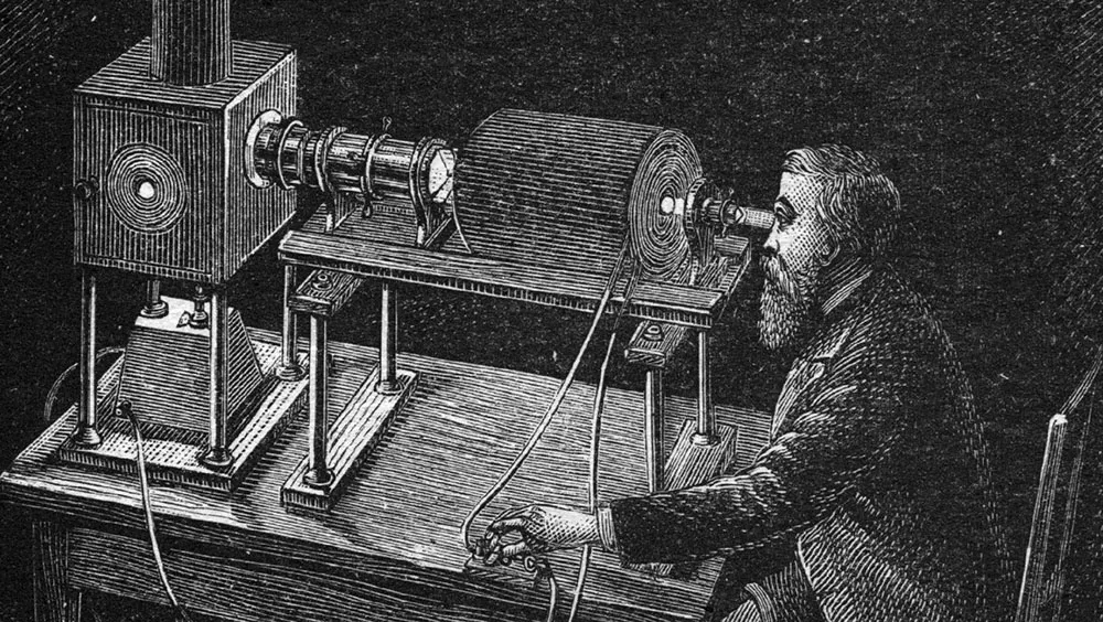 James Clerk Maxwell, sits at a machine investigating magnetism and light © Getty Images
