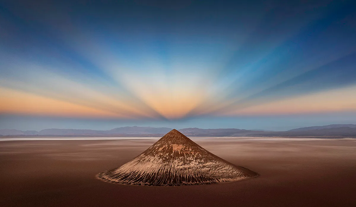 Huge mountain with sunrise behind