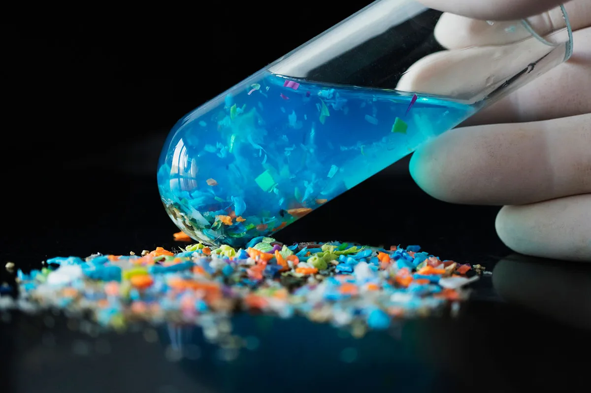 A bottle of liquid with microplastics in it 