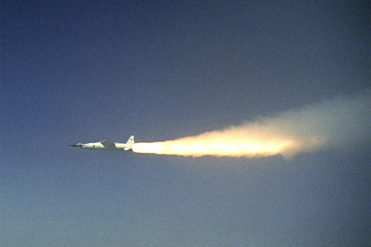 Jet plane with flames shooting out of the back